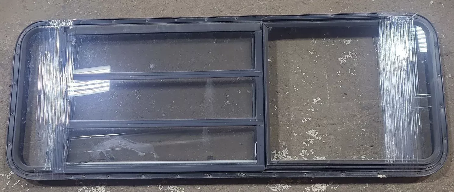 Used Black Radius Emergency Opening Window : 21 3/4" W x 59 3/4" H x 1 1/4" D