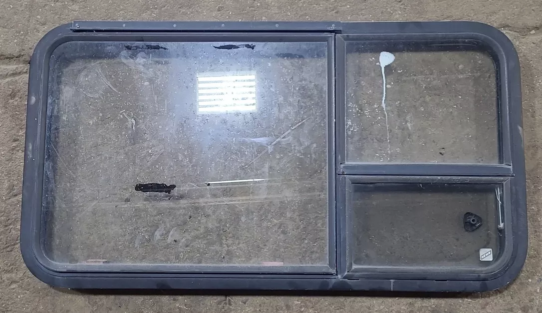 Used Black Radius Emergency Opening Window : 41 3/8 ” W x 21 5/8 ” H x 1 7/8 ” D