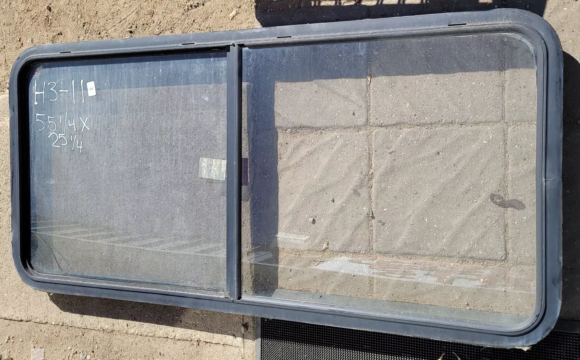 Used Black Radius Emergency Opening Window : 55 1/4 ” W X 25 1/4 ” H X 2 ” D